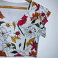 CAMISETA Corta estampada flores. Talla S*