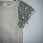OFFCORSS Body crema con manga de lentejuelas plateadas. T14