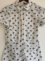 H&M Blusa camisera manga corta estampada moñitos. Talla 4