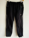 ADIDAS Pantalón deportivo para hombre con cortes. Talla L