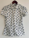 H&M Blusa camisera manga corta estampada moñitos. Talla 4